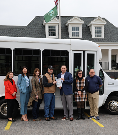 Pelham Officials Pose with Donated Bus for Senior Center