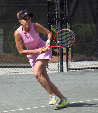 Womens National Tennis Player running for a volley